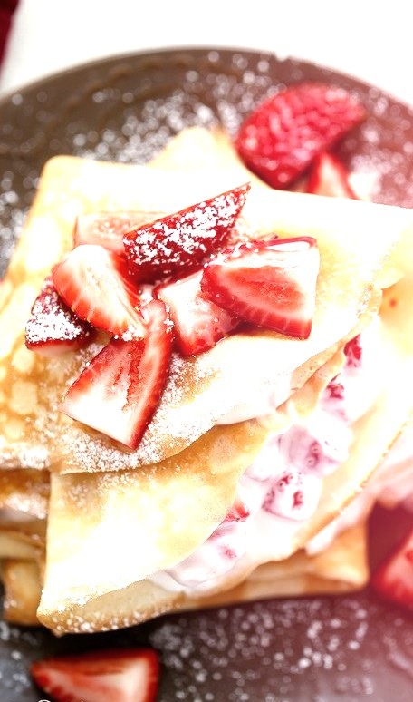 Macerated strawberries and cream crepes